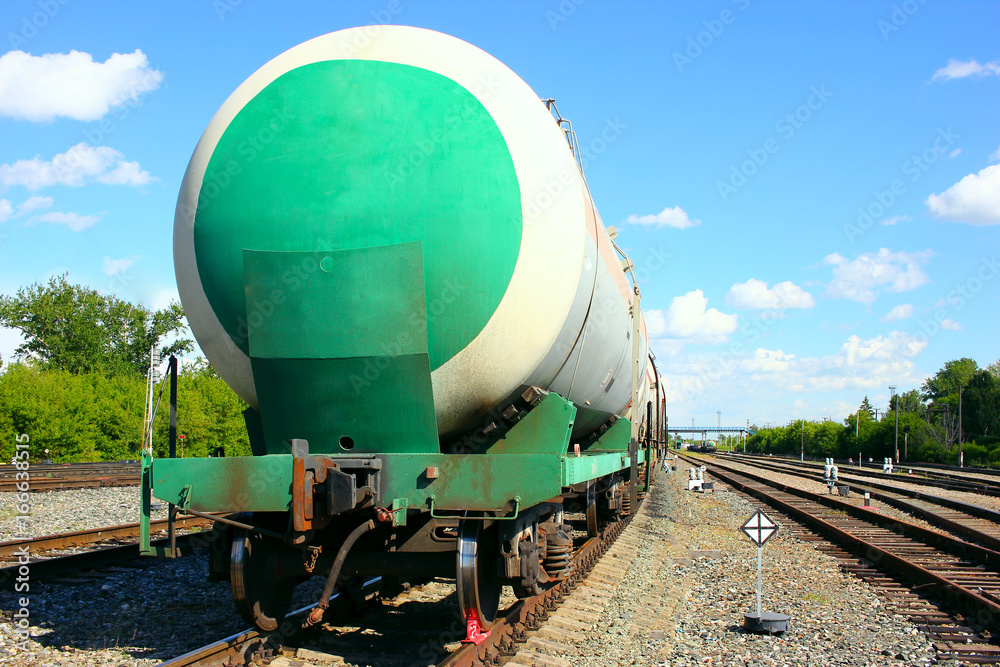 Naklejka premium Rail tank cars, part of a train with combustible fuel, are at the railway station