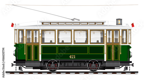 An old biaxial tram of green color. City Ecological transport. Side view.