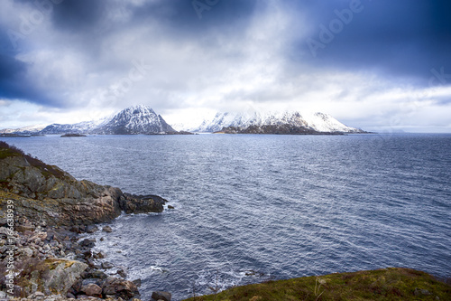 Travel Ideas and Scenic Destinations. The Lofotens Scenery with Group of Islands Against Snowy Mountains on Background. During Spring Time