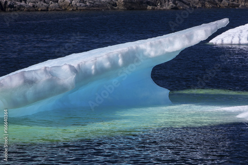 iceberg with blue and green color at Fogo Island, Newfoundland, Canada photo