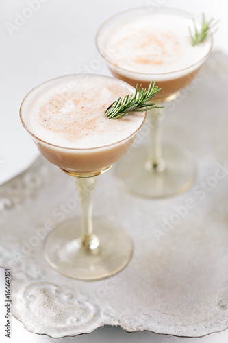 Chocolate creamy cocktails garnished with rosemary