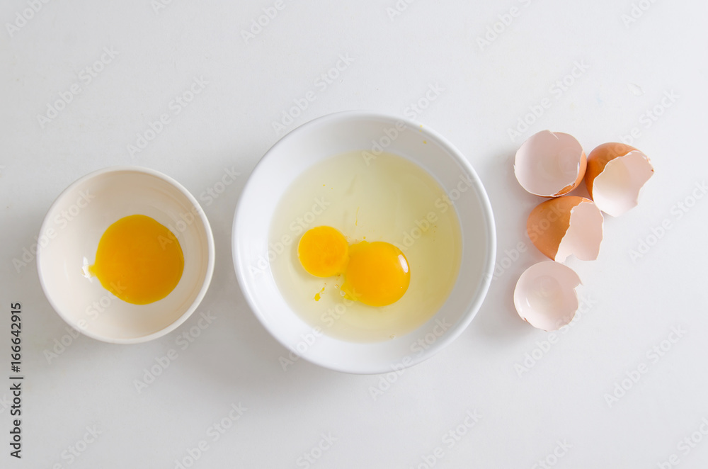 Fresh egg yolk in a bowl prepare for cooking,Food ingredient Fresh egg yolk in a bowl prepare for cooking,Food ingredient