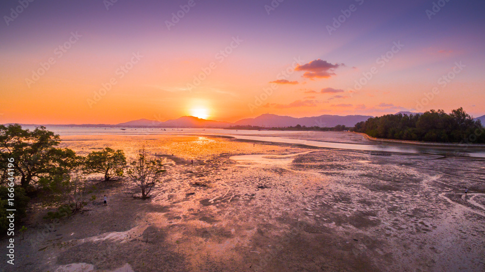 golden sky above the river in the sea