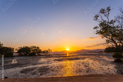 golden sky above Chalong bay shore