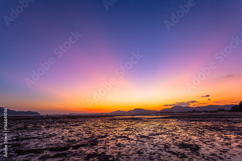 golden sky above Chalong bay shore