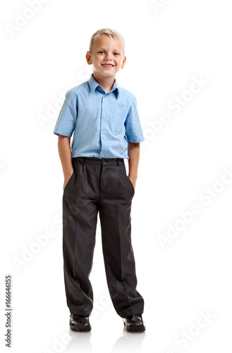 Cheerful cute schoolboy in formalwear