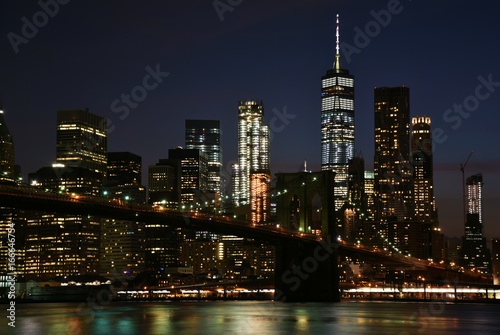 The Brooklyn Bridge and skyline of downtown Manhattan from Brooklyn at night. 