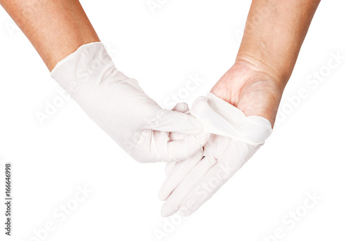 Hand throwing away white disposable gloves medical.