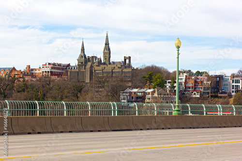 A view on Georgetown from Key Bridge in spring. Washington DC suburb on a high bank of Potomac River.