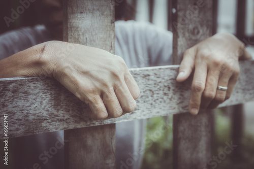 Photos prisoner behind wooden bars : social issue