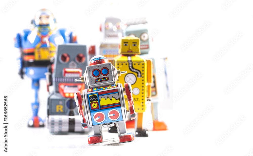 Obraz premium Group of Retro Tin Robots on a white background with copy space