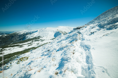 Snowy mountains view © alipko