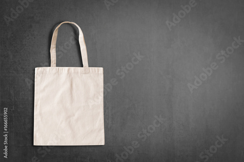 Tote bag fabric cloth shopping sack mockup isolated on black chalckboard copyspace (clipping path)