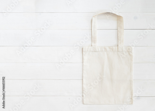 Tote bag mock up canvas fabric cloth shopping sack on white wood