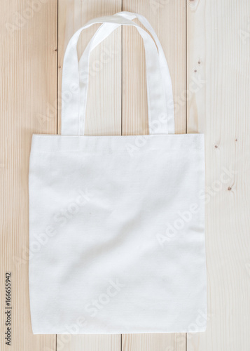 Tote bag mock up canvas fabric cloth shopping sack on white wood
