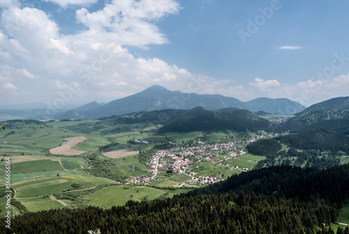 Komjatna village with nice countryside around and Velky Choc hill on the background in Slovakia photo