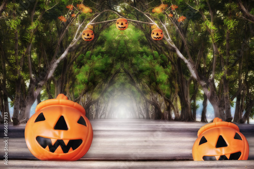 Halloween pumpkin with tree tunnel on wooden plank © smshoot