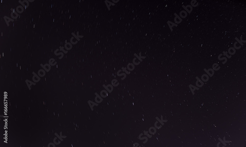 Short star trails - night sky background.