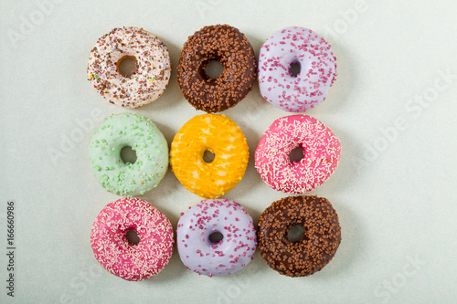 Colorful donuts on a light background.