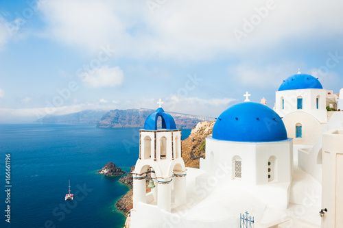 White church with blue domes on Santorini island  Greece