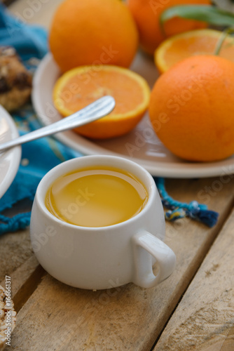 Healthy breakfast, fruit, corn flakes, milk and orange juice on the wooden table