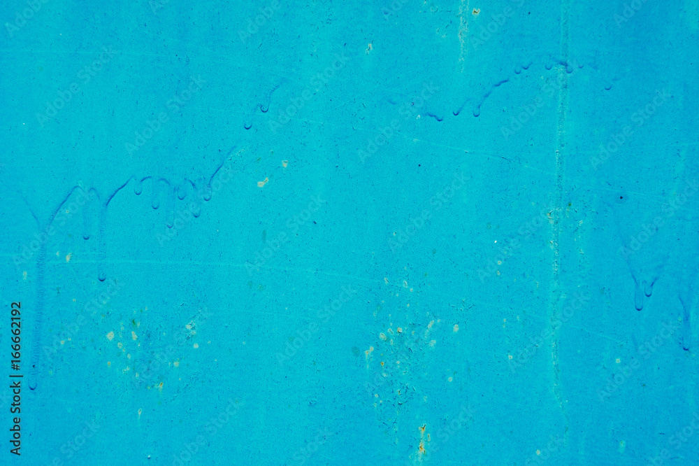 Texture of the old wall, painted in blue paint. Background for design with space for text.