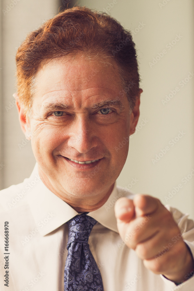 Fotografie Successful man pointing to camera with finger