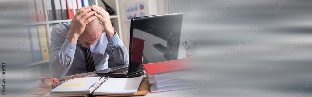 Fotografie Tired businessman with headache