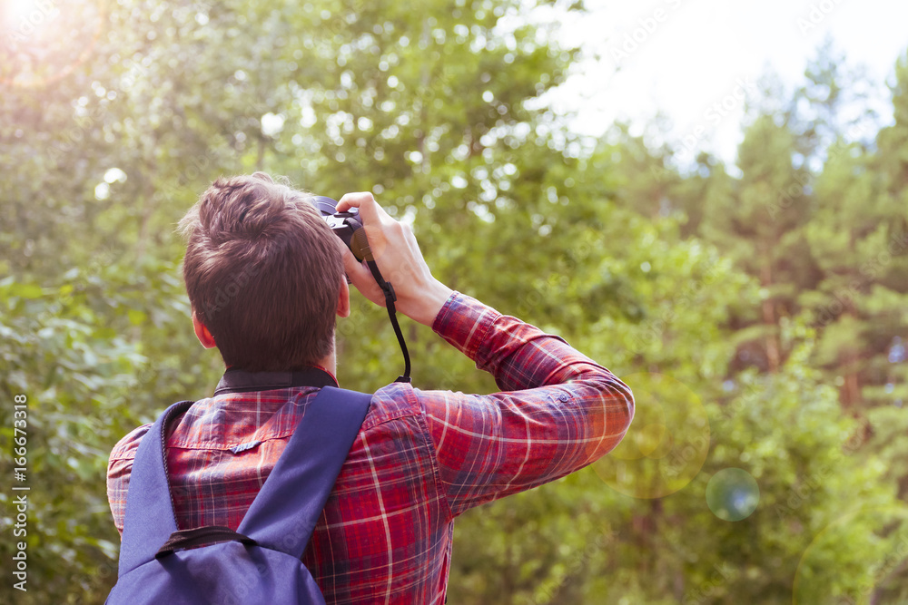 A young man takes photos of nature. Summer-Autumn. A young man takes photos of nature. Summer-Autumn.