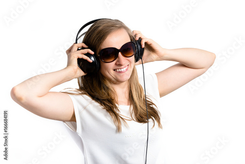 Listening music. Woman in headphones on white background.