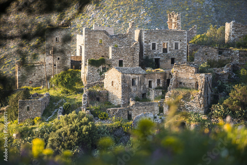 The ancient towers of Vathia among wild spring flowers on the Mani Peninsula in the Peloponnese, Greece photo