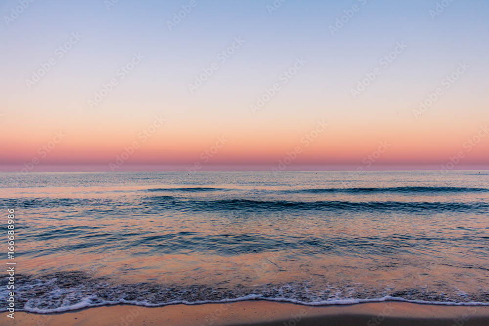Minimalist sunrise with beautiful colours over the sea