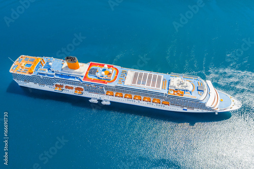 Luxury cruise liner in the blue sea, top view
