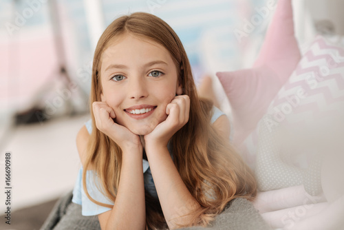 Girl of heavenly beauty smiling into camera
