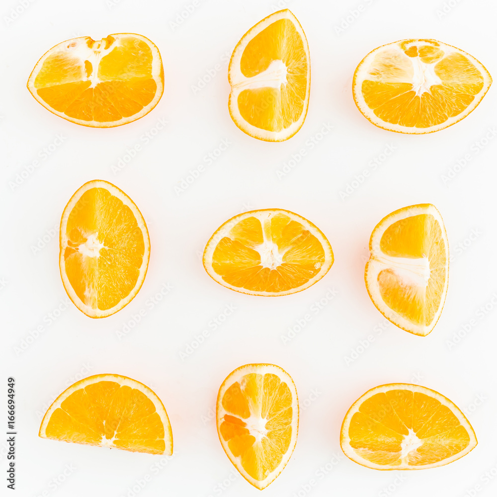 Food pattern of slices citrus fruits isolated on white background. Flat lay, top view.