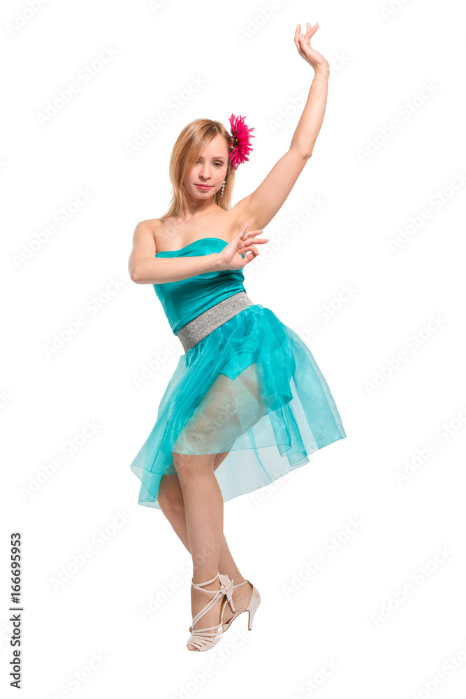 Beautiful young blonde girl in a blue top, blue skirt and a pink barrette in the shape of a flower on her head dancing Beautiful young blonde girl in a blue top, blue skirt and a pink barrette in the shape of a flower on her head dancing