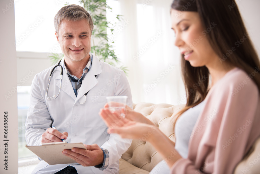 Attractive medical worker making notes Attractive medical worker making notes