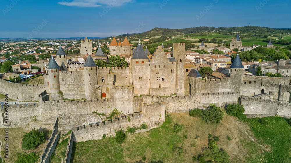 Aerial top view of Carcassonne medieval city and fortress castle from above, Sourthern France
