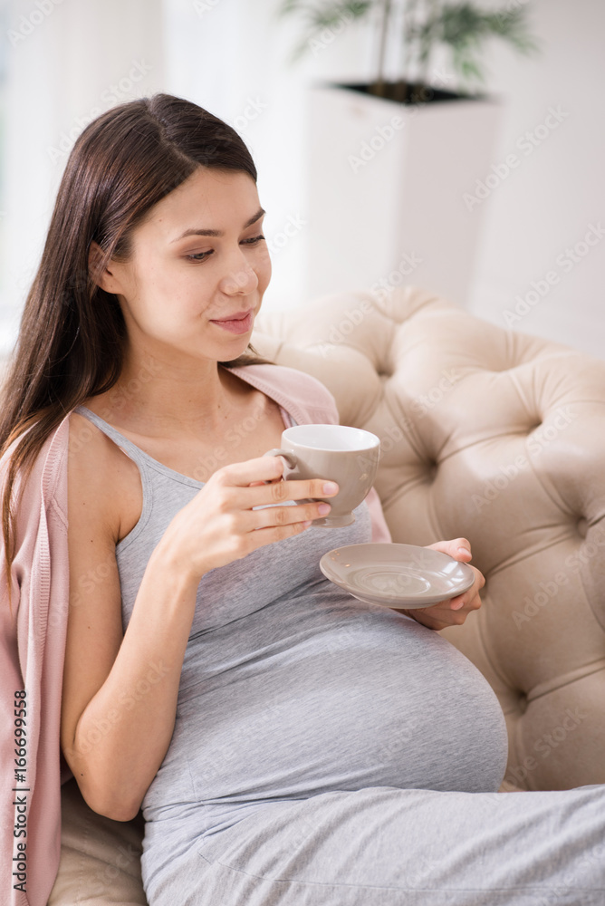 Concentrated girl thinking about her baby Concentrated girl thinking about her baby