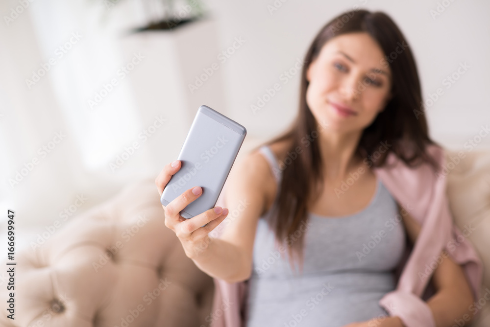Focused photo on telephone that being in female hand Focused photo on telephone that being in female hand