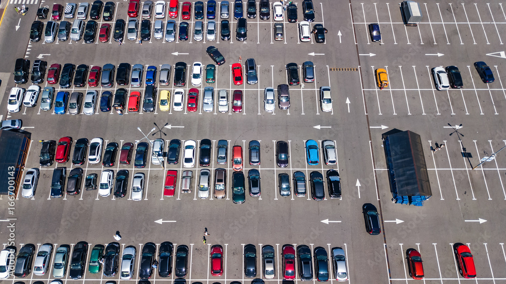 Aerial view of parking lot with many cars from above, transportation and urban concept
