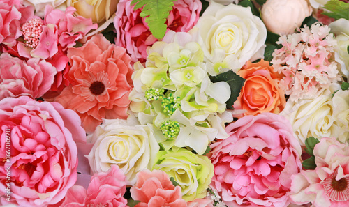 Fototapeta Naklejka Na Ścianę i Meble -  Bunch of Colorful Artificial Flowers.