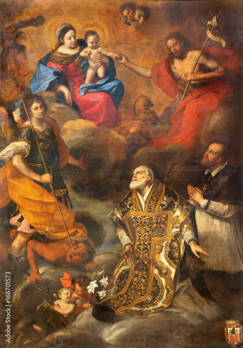 TURIN, ITALY - MARCH 13, 2017: The painting of Madonna and Jesus, with the st. Philip Neri and archangel Michael in Duomo by Caravoglia da Crescentino (1620 - 1691).