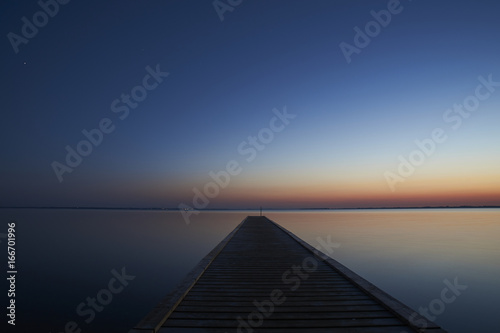  Silence and a beautiful view over the fjord from Vadum beach in Denmark at midnight - one hour after sunset 