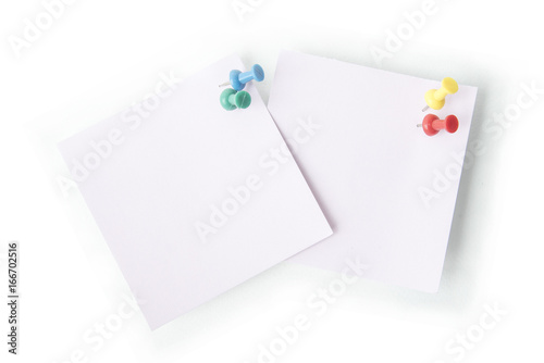 Note paper with push pin on white background