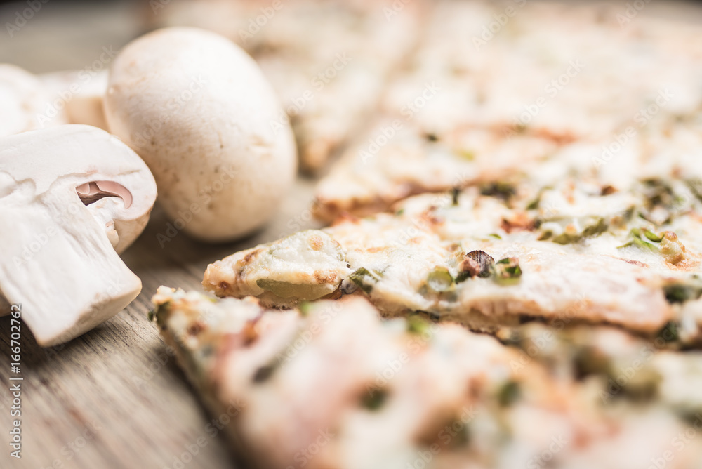 Pieces of pizza and mushrooms champignons close-up Pieces of pizza and mushrooms champignons close-up