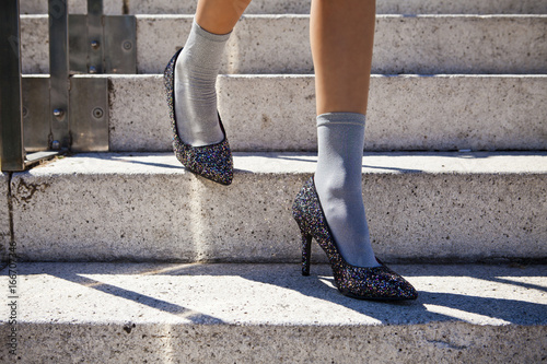 woman with a heels in a stairs