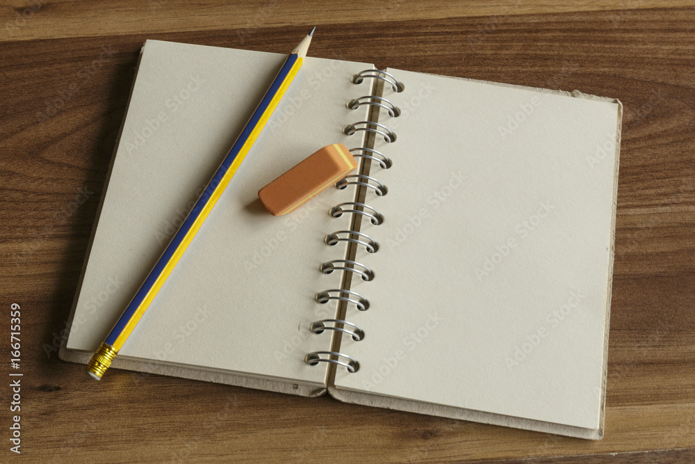 School Supplies. Standard sharpened pencil and eraser on spiral bound notepad. School Supplies. Standard sharpened pencil and eraser on spiral bound notepad.
