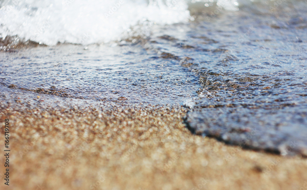 Wet sand and waves on the sea Wet sand and waves on the sea