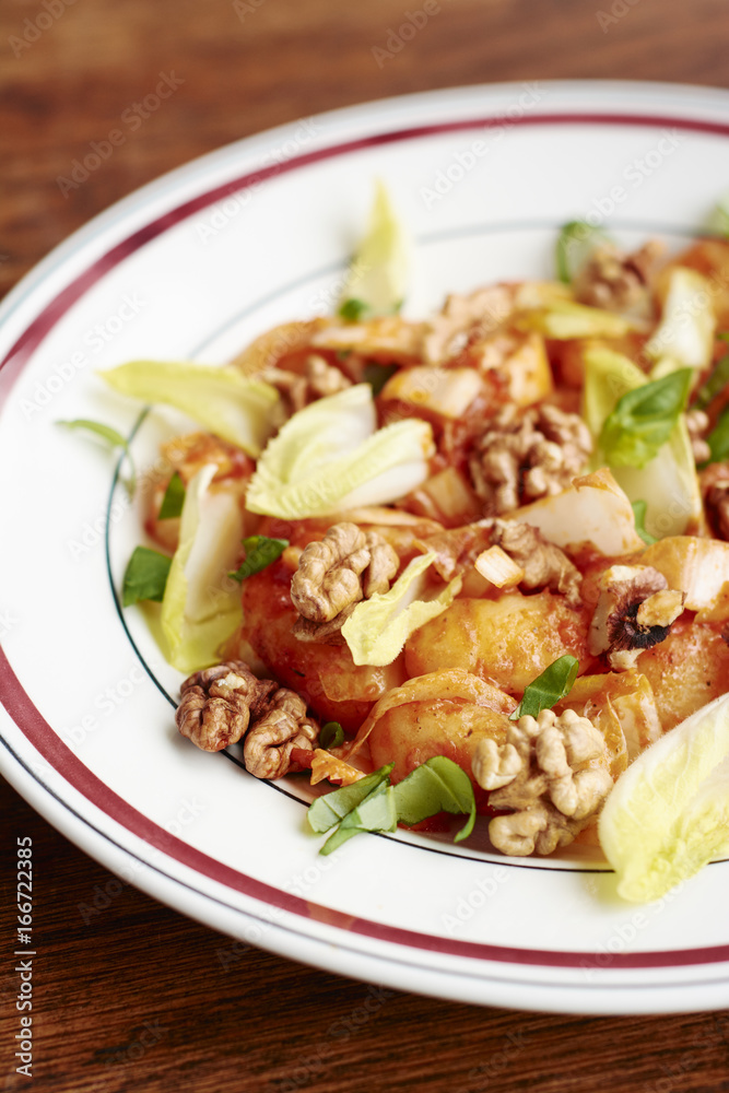 Gnocchi with Belgian Endive, Walnuts and Roasted Pepper Sauce Gnocchi with Belgian Endive, Walnuts and Roasted Pepper Sauce